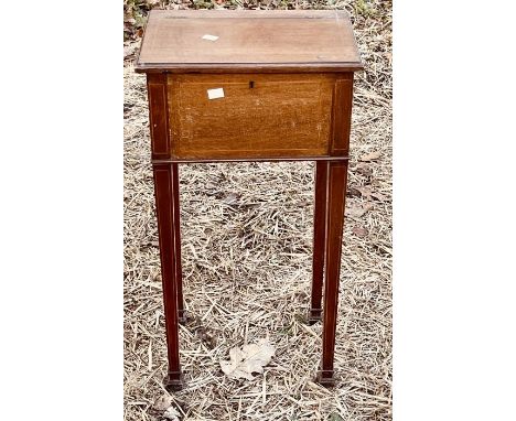 An Edwardian Sheraton revival mahogany and satinwood jewellery trinket box, raised on tapered supports; an early 20th century