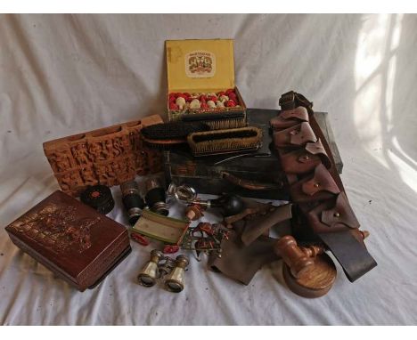 A quantity of leather and wooden items to include a boat lamp, pith helmet, figures, and a part bone chess set, etc