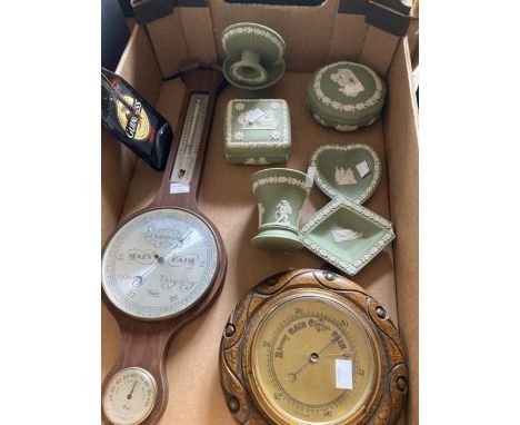one box containing 2 barometers, a Guiness clock, and seven pieces of green wedgewood (some corner damage to diamond shaped d