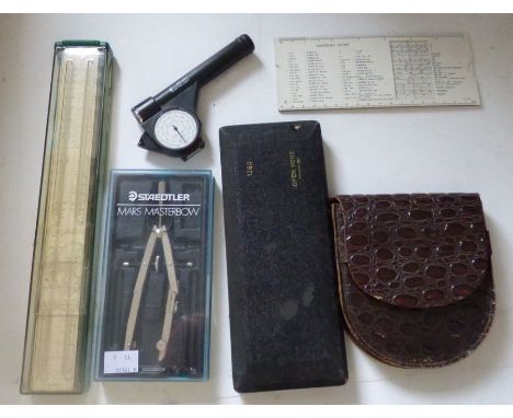 A Fowler magnum long scale calculator, a set of drawing instruments, cased, a slide rule etc