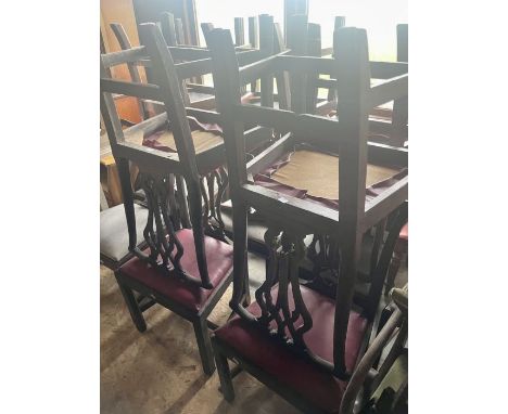 A set of four George III oak dining chairs, in a Chippendale style, serpentine rail on a pierced splat, leather inlay seat, r