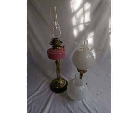 x2 oil lamps, one with a pink glass oil well and a copper insert arts and crafts style standard lamp