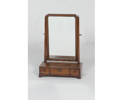 Walnut and parcel gilt dressing table mirror, late 18th or early 19th Century, rectangular plate over a base fitted with thre