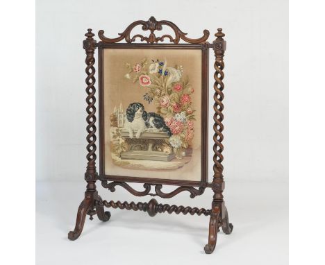 Victorian rosewood and petit-point needlework firescreen, circa 1845, the tapestry featuring Queen Victoria's spaniel 'Dash' 