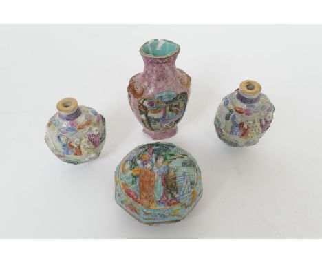 Pair of Chinese biscuit moulded snuff bottles, 19th Century, each moulded with figures, painted Qianlong mark, height 7.5cm; 