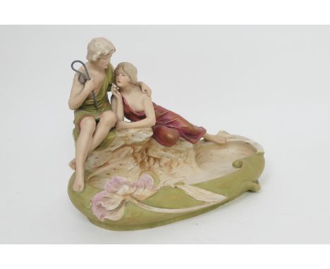 Royal Dux Art Nouveau style figural bowl, the bowl formed as a pond with lily pads, mounted with an embracing couple, finishe