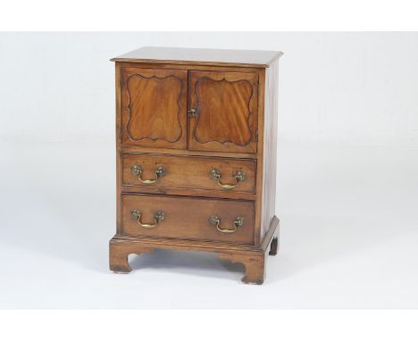 Georgian style mahogany night cabinet, having two shaped square recessed panel doors opening to a cupboard over two short dra