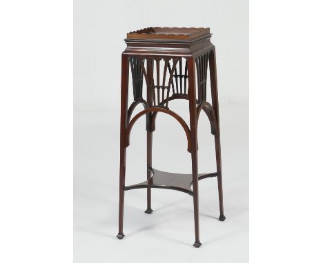 Edwardian mahogany jardiniere stand, galleried square top over pierced slats, on tapered square section legs with a platform 