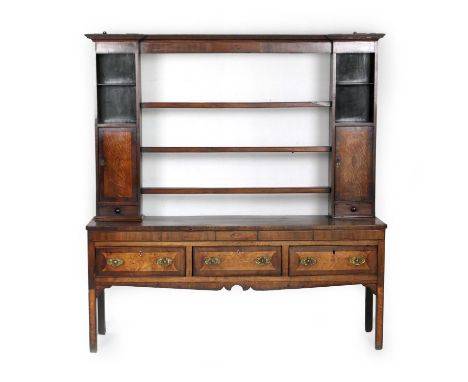 George III oak and mahogany inlaid dresser, circa 1800, having a plate rack with three central shelves flanked by cupboard do