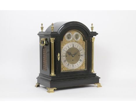 Victorian ebonised repeating musical bracket clock, the domed top with cast brass finials, twin carrying handles, 20cm arched