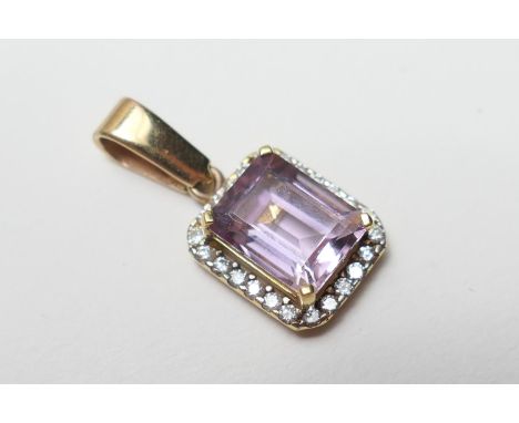 Diamond and amethyst cluster pendant, in 18ct gold, the step cut pale amethyst approx. 9mm, in a four claw mount bordered wit