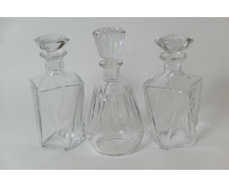 Pair of Baccarat faceted crystal spirit decanters, 22.5cm and 23.5cm; also a Baccarat, Hine et Cie Cognac crystal decanter, 2