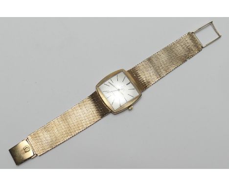 Omega De Ville 9ct gold gent's bracelet wristwatch, circa 1970, cushion shaped cased with 24mm square dial, signed and with b
