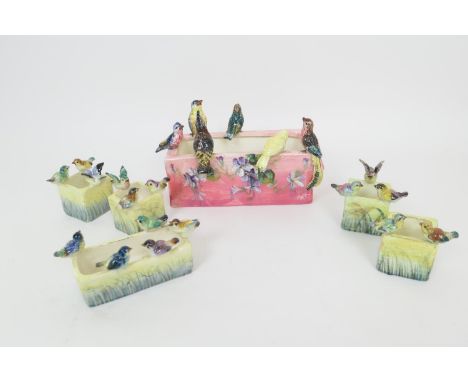 P Perret, Vallauris, faience flower trough, glazed in pink and surmounted with birds, painted mark, 26cm; also five similar F