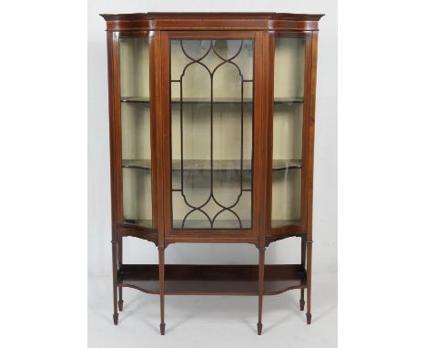 Late Victorian mahogany and satinwood inlaid breakfront display cabinet, circa 1900, having a central glazed door with ogee g