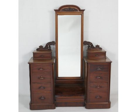 Victorian mahogany duchess dressing table, circa 1870, having a long rectangular mirror with arched top over a barrel fronted