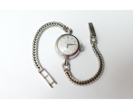 Omega stainless steel lady's vintage wristwatch, 15mm dial with baton numerals, manual wind, on a white gold herringbone brac