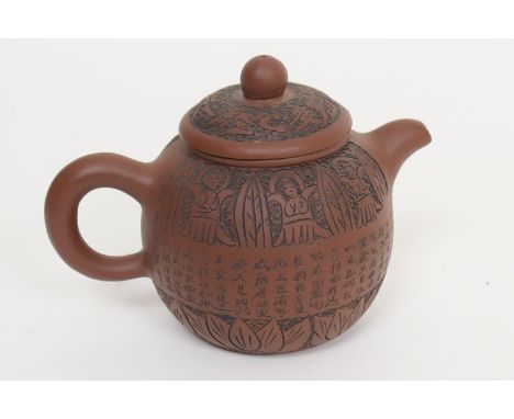 Chinese Yixing teapot, globular form incised with a band of script, within carved leaf borders, the base with a Zhuanshu seal