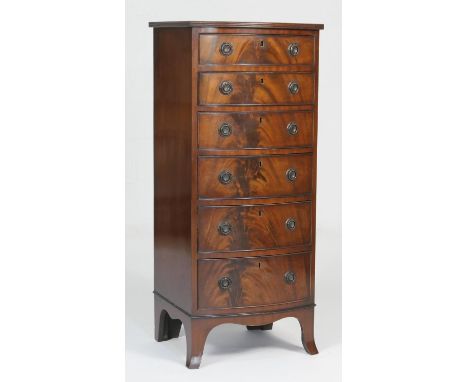 Quality reproduction mahogany bowfront pillar chest, 20th Century, fitted with six flame mahogany graduating drawers with bra