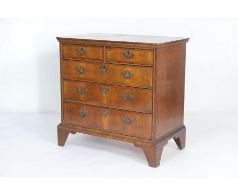 Walnut chest of drawers, 18th Century with later alterations, having two short and three long graduating drawers, crossbanded