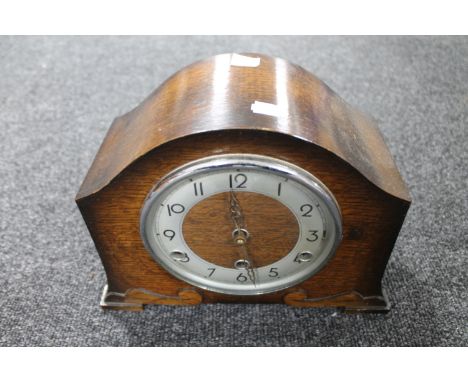 A 1930's Bentima oak eight day mantel clock with silvered dial