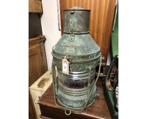 A vintage brass meteorite ship's lamp 