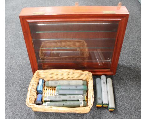 A display case together with a wicker basket containing Hornby and Lima 00 gauge engines 