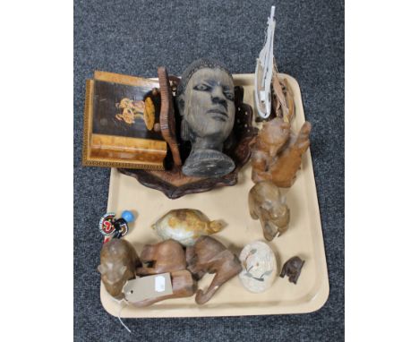 A tray of hardstone inlaid trinket box, Black Forest style carved bears, carved elephants, two models of yachts etc