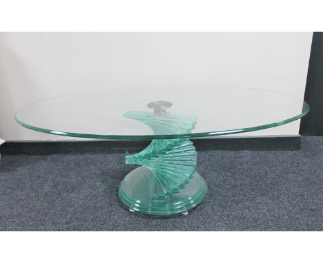 A circa 1970's Italian oval glass coffee table on twist pedestal 