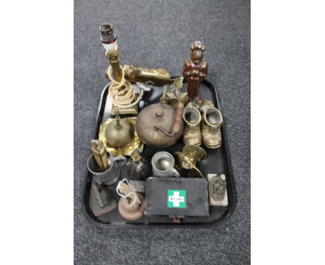 A tray of antique metal ware including brass nutcrackers, first aid tin, pewter tankards, brass lamp base, hand bells etc