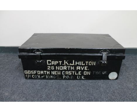 An early 20th century tin trunk named to Captain K.J. Hilton 