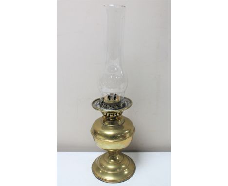 An early twentieth century Duplex brass oil lamp with glass chimney 