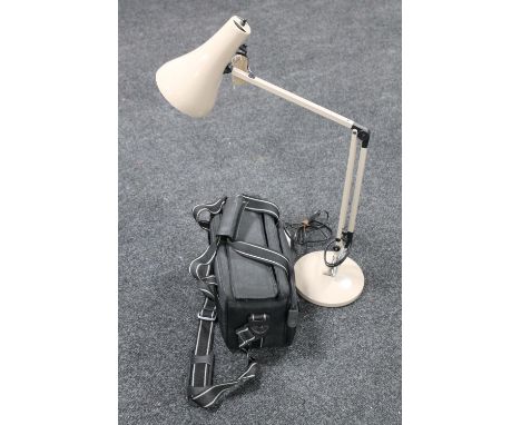 An angle poise desk lamp, together with a camera bag containing brass mantel clock, camera accessories