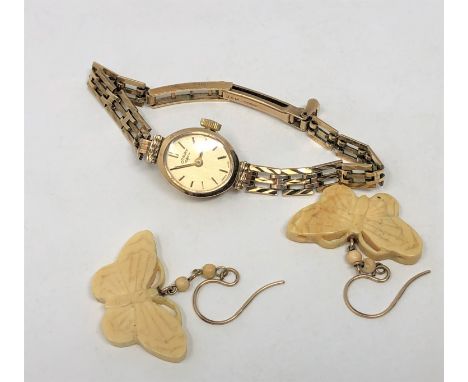 A 9ct gold lady's Rotary wrist watch (11.3g gross), together with a pair of butterfly earrings.