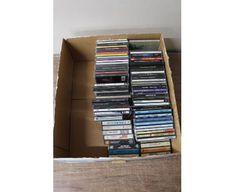 A box of CD's and cassette tapes : Michael Jackson, The Shadows, Eagles etc 