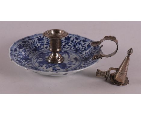 A blue and white porcelain dish with silver mount made into a candlestick, China, Kangxi, early 18th century. Silver mount wi