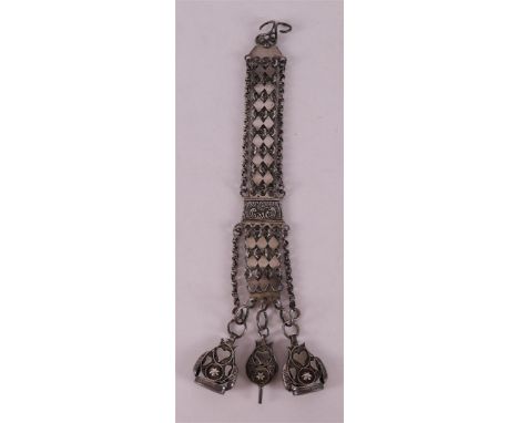 A 2nd grade 835/1000 silver chatelaine with filigree watch key and signette, Holland, 19th century, length 26 cm.