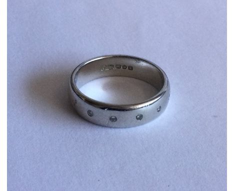 A good diamond six stone plain half eternity ring in 18 carat gold rubover mount. Approx. 6 grams. Est. £100 - £150.