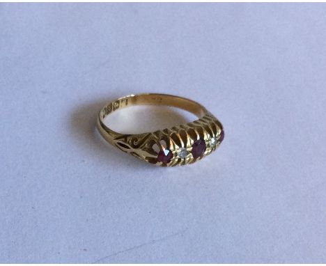 A ruby and diamond five stone ring in gold claw mount. Approx. 3 grams. Est. £50 - £80.