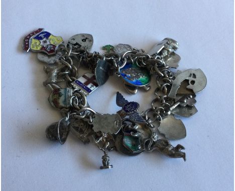 A heavy silver curb link charm bracelet. Approx. 74 grams. Est. £20 - £30.