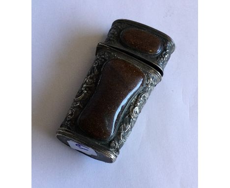 A good Antique chased silver etui mounted with goldstone. Approx. 47 grams. Est. £60 - £80.