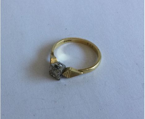 An 18 carat gold and diamond single stone ring. Approx. 3 grams. Est. £50 - £80.