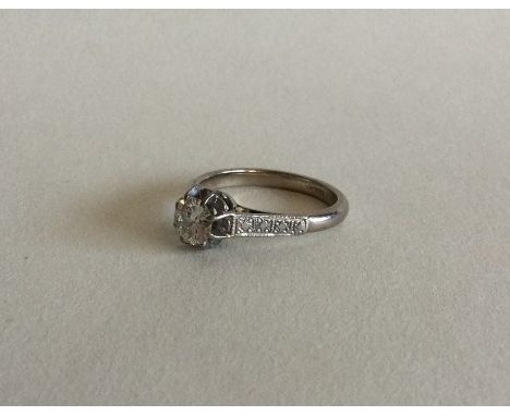 A good diamond single stone ring in platinum claw mount. Approx. 3 grams. Est. £150 - £200.