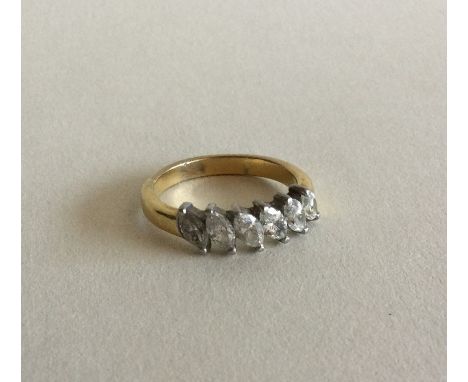 A good diamond six stone pear shaped ring in two colour gold setting. Approx. 5 grams. Est. £100 - £150.