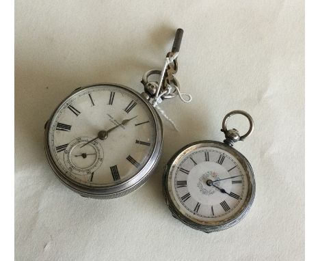 An engine turned silver pocket watch together with a fob watch. Est. £30 - £50.