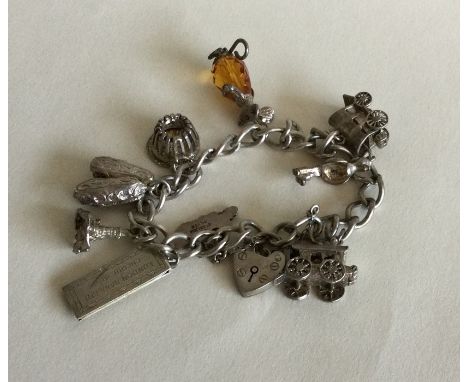 A silver curb link charm bracelet with heart shaped padlock. Approx. 42 grams. Est. £30 - £40.