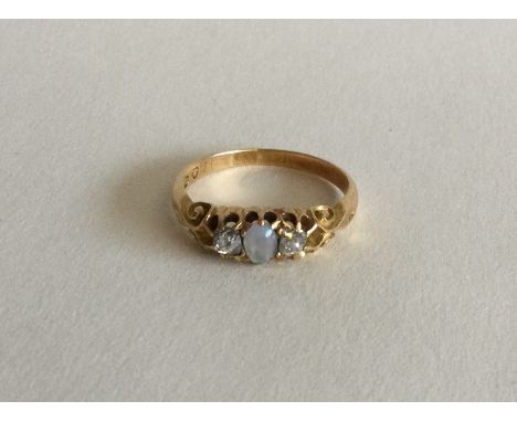 A Victorian opal and diamond three stone ring in claw mount. Approx. 3 grams. Est. £60 - £80.