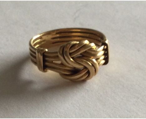 An 18 carat gold keeper ring of typical form. Approx. 5 grams. Est. £100 - £150.