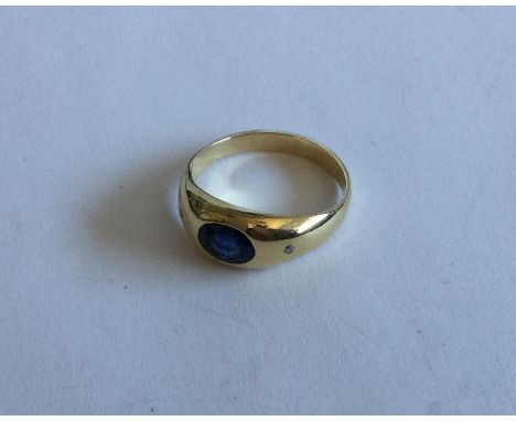 A sapphire and diamond three stone gypsy set ring with rubover gold mount. Approx. 5 grams. Est. £50 - £80.