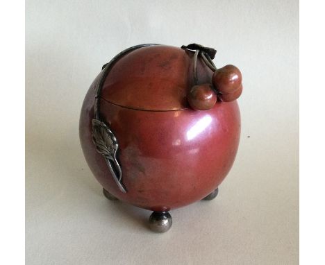 An unusual Art Deco silver and copper mounted inkwell of spherical design mounted with leaves. Approx. 160 grams. Est. £150 -